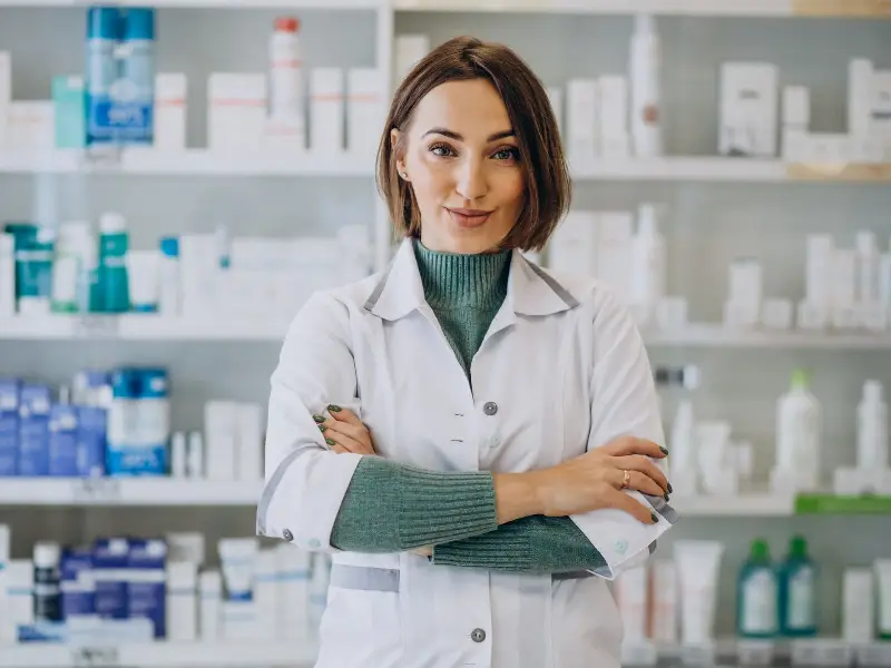 Young woman pharmacist at pharmacy